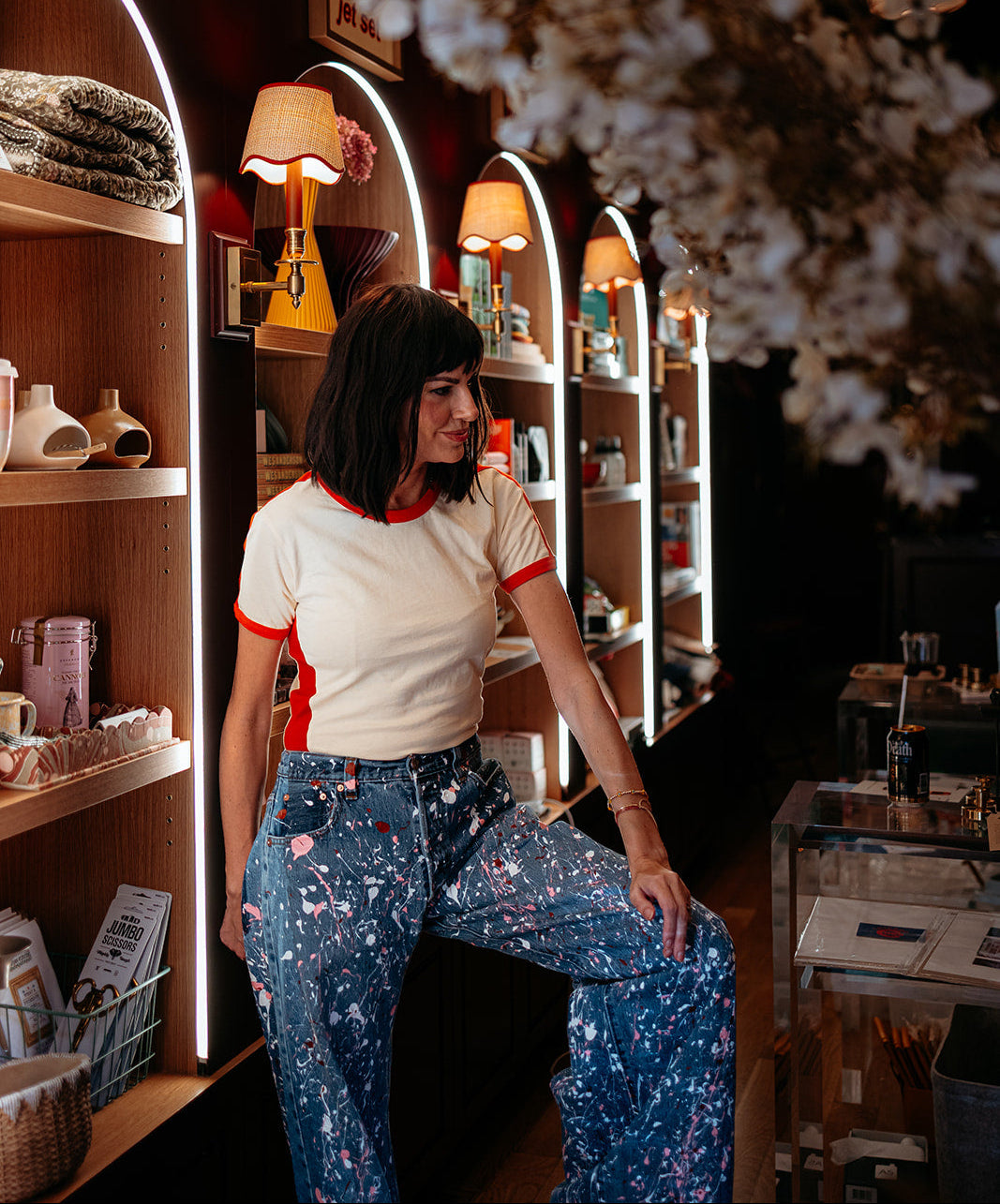 Givanne's founder Ann, standing in front of the curated collection shelves at the Lincoln Park location in Chicago