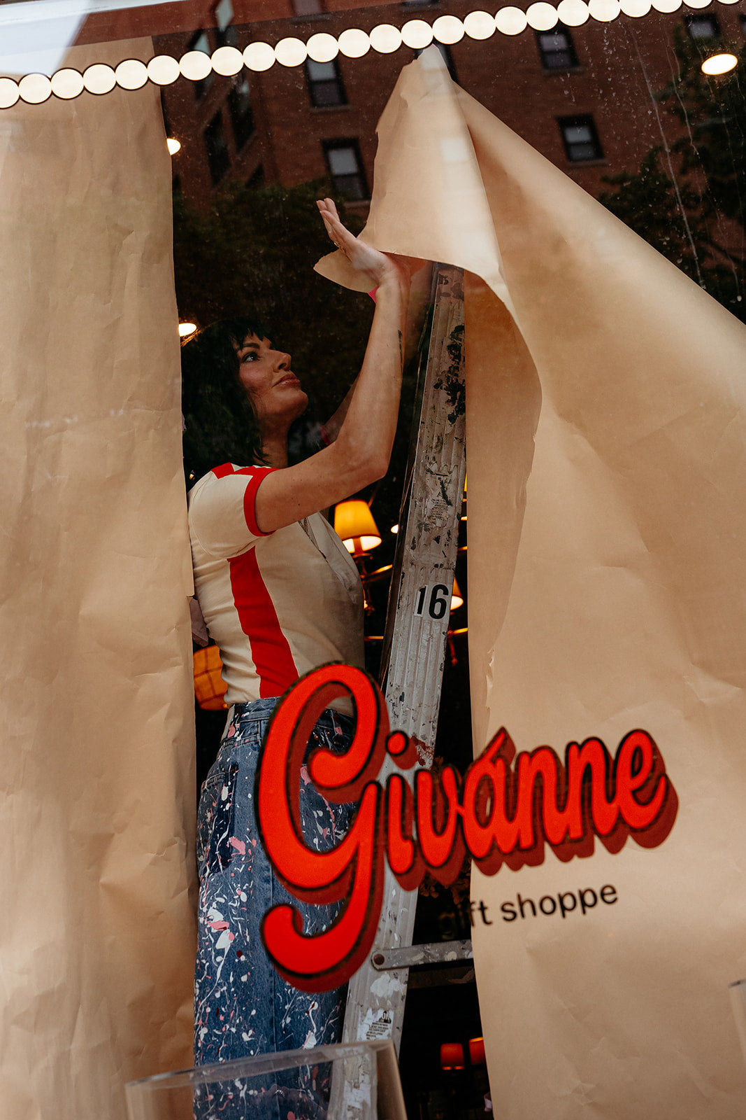 Founder, Ann, standing in the Givanne Shoppe window in Lincoln Park, Chicago
